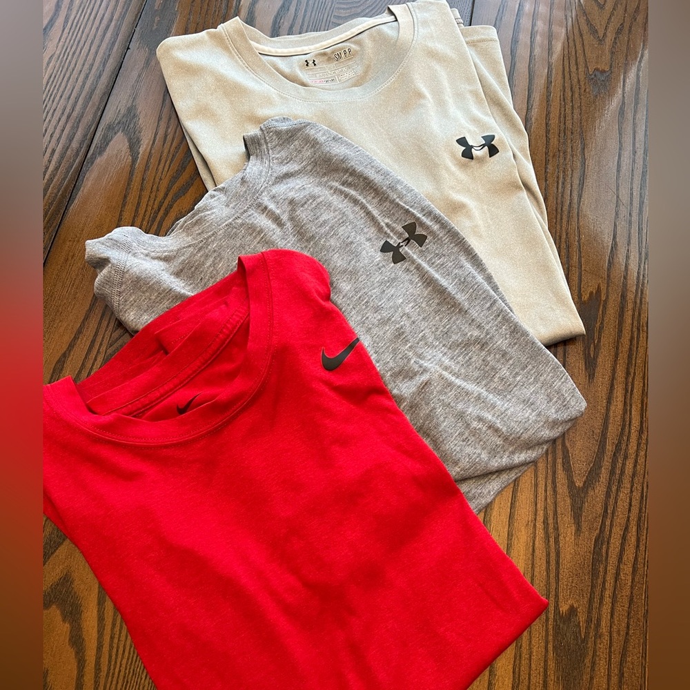 Lot of 3 loose Dri-fit shirts…2 Under Armour and 1 Nike. All adult smalls.